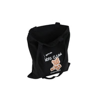 Black canvas shoulder bag with bear graphic on front panel