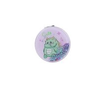 Round lavender compact mirror with cute dinosaur graphic and purple glitter edge