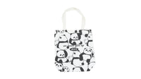 White canvas shoulder bag with all-over panda pattern and 'we never grow up 2023'