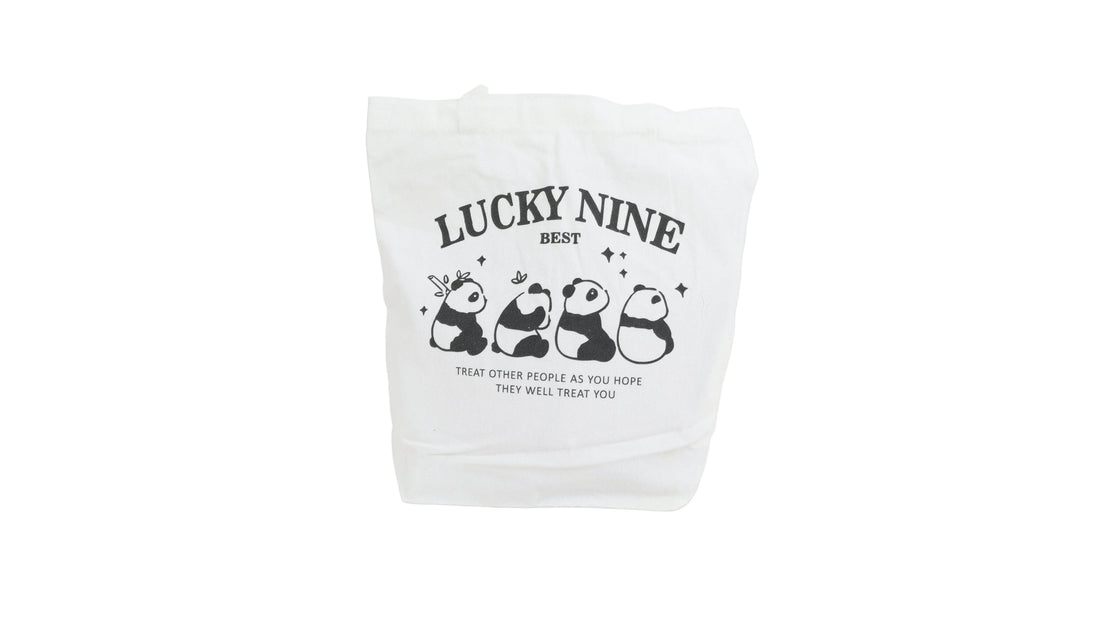 White canvas shoulder bag with 'LUCKY NINE' panda graphic and text