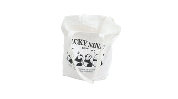 White canvas open-top shoulder bag with panda graphic and text print