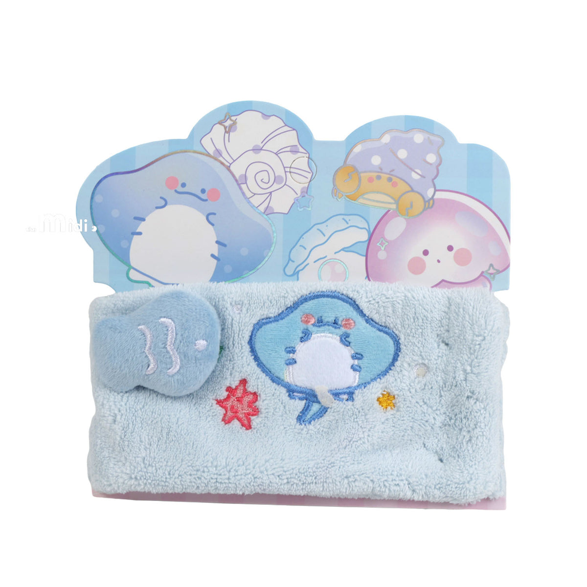 Ocean-themed plush headband, light blue with dolphin and star patches