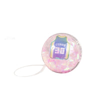 Iridescent pink basketball bouncy ball with CURRY 30 print and attached white string