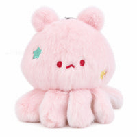 Pink plush keychain with embroidered face, teal star patch, red and yellow accents