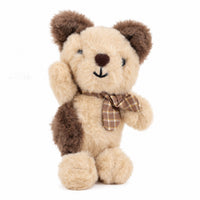 Beige plush dog keychain with stitched face, metal loop, and brown plaid bow