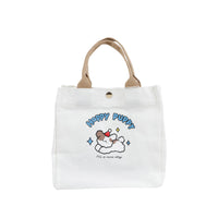White handheld bento bag with Happy Puppy dog cartoon and small gold button