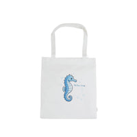 White canvas shoulder bag with blue seahorse graphic on the front panel