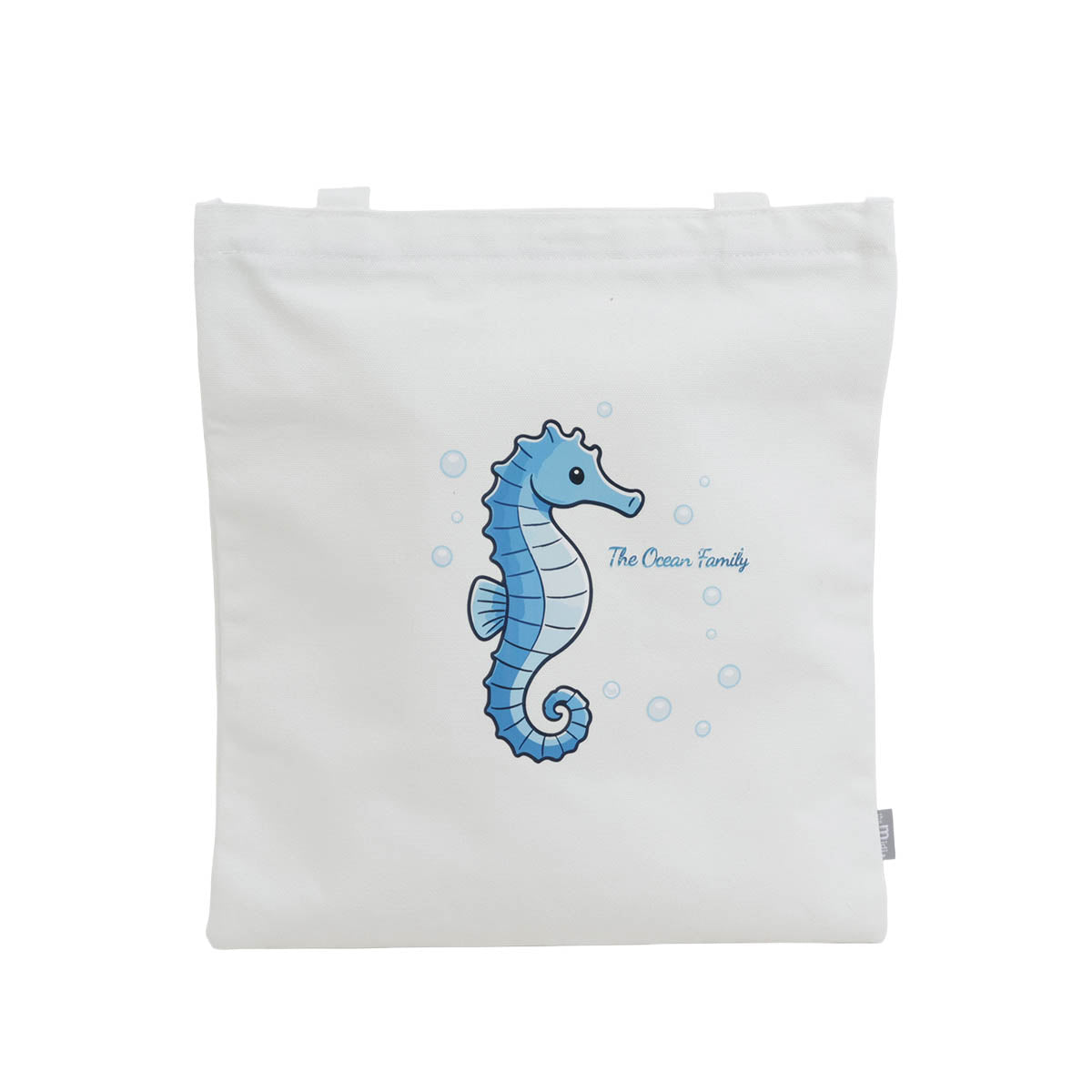 White canvas shoulder bag with blue seahorse graphic and bubbles on back panel