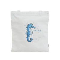 White canvas shoulder bag with blue seahorse graphic and bubbles on back panel