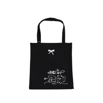 Black tote bag with dog illustration and “NICE DAY” print