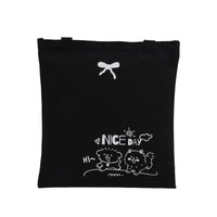 Black tote bag with bone icon and dog “NICE DAY” print