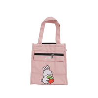 Pink vertical tote-style lunch bag with top handle and bunny graphic front pocket