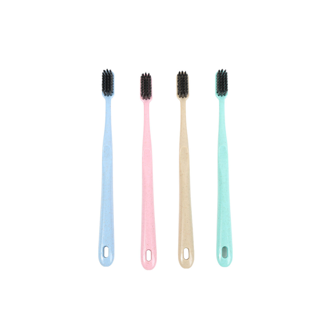 Four toothbrushes with soft bristles in blue, pink, beige, and mint, laid flat.