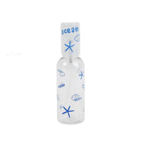 Clear 80ml empty travel spray bottle with blue ocean doodle print and mist spray top