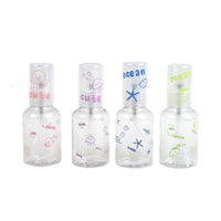 Set of 4 travel empty spray bottles with clear plastic and ocean-themed prints