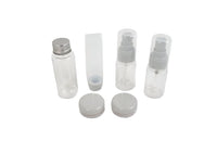 Travel empty bottle set with clear bottles, sprayer tops, and white containers