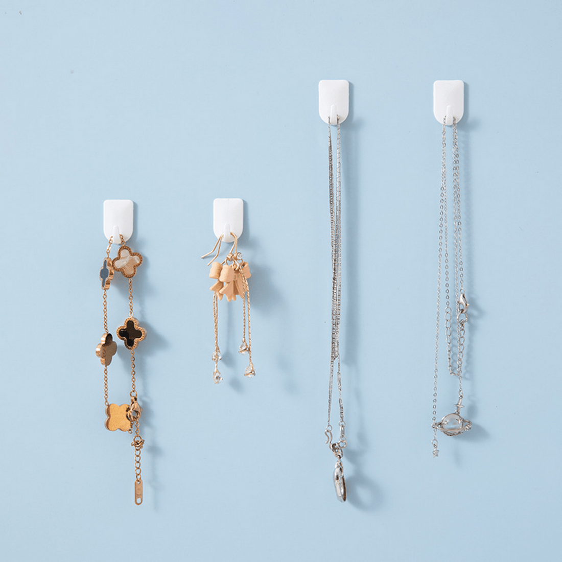 Self-adhesive hook set with decorative gold-toned chain and flower charms