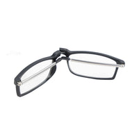 Foldable reading glasses folded, side view with black hinge and metal arms
