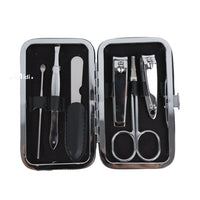 Manicure tools set in open case with nail clippers, scissors, and files