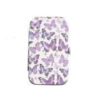Butterfly manicure case with purple butterfly silhouettes and metal clasp sides.
