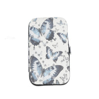 Butterfly manicure case with blue butterfly pattern and zipper closure.