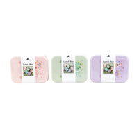 Kids lunch box in mint, pink, and purple colors, each with a white center latch
