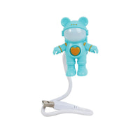 Blue astronaut bear light with USB cable connected