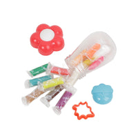 Transparent container with red flower lid and assorted mini bottles plus plastic shapes