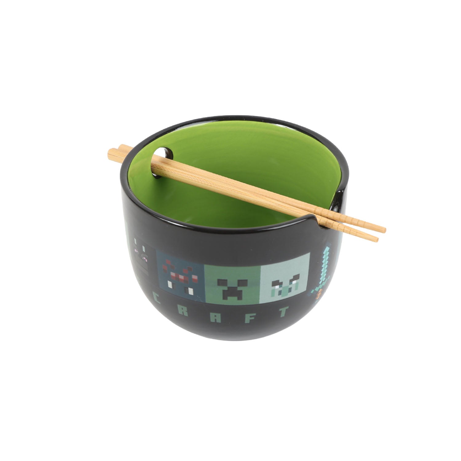 Black ramen bowl with green interior and pixel pattern, light wood chopsticks laid across