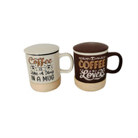 Ceramic coffee mug pair: white “Coffee is like a Hug in a Mug” and brown “Coffee Lovers”