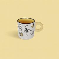 Ceramic cup with cute animal icons and cream handle, dark inner rim