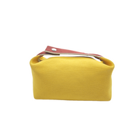 Canvas bag in yellow with burgundy top trim and metal snap closure