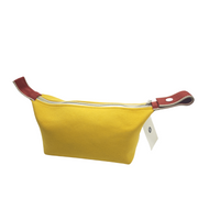 Yellow canvas bag with burgundy accents, silver snap hardware, and front view