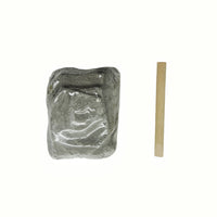 Gray dinosaur fossil block with molded texture and a thin wooden stick