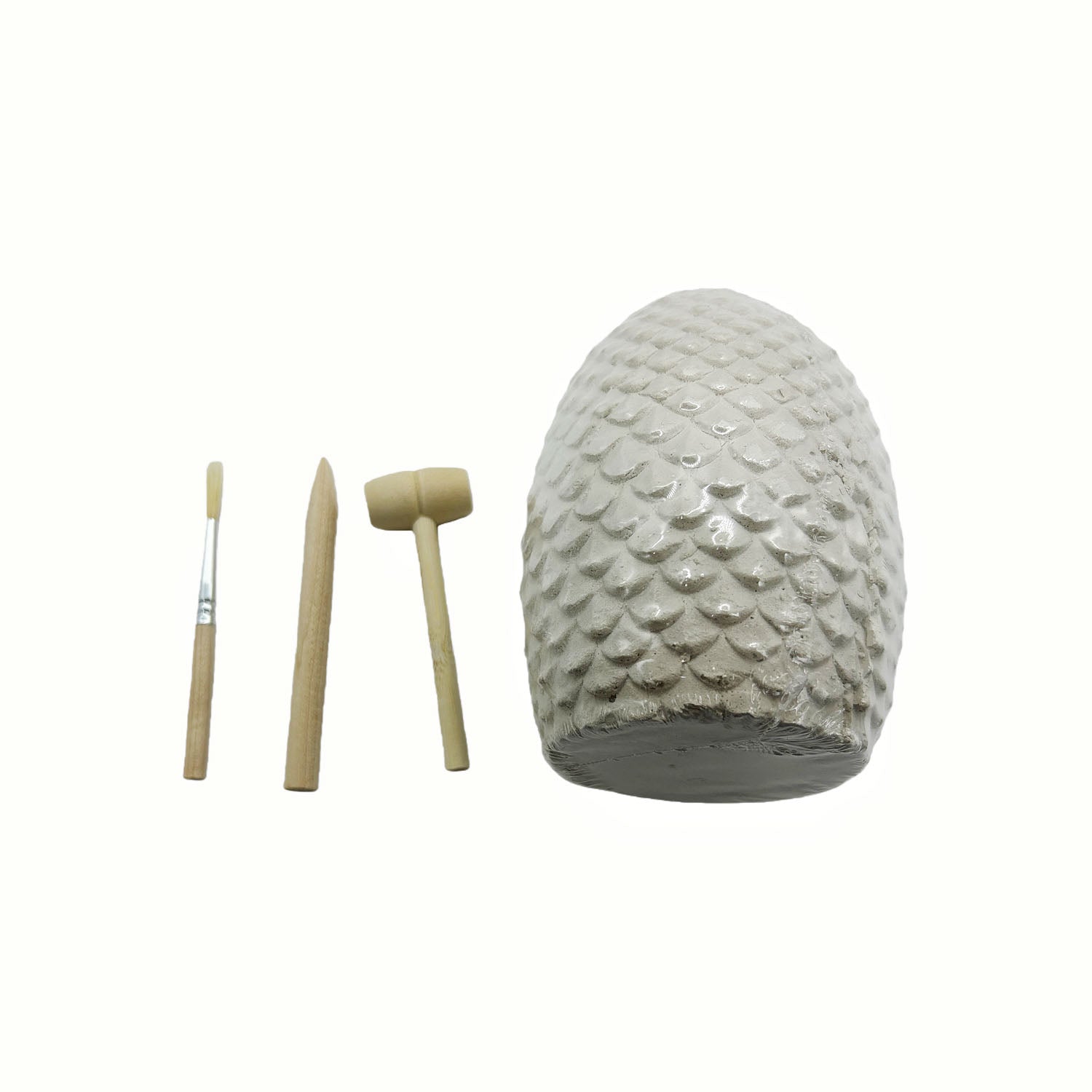 Stone fossil egg with textured scales and three wooden excavation tools