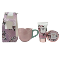 Gift set mug with hand cream tube and body scrub jar, floral peony print.