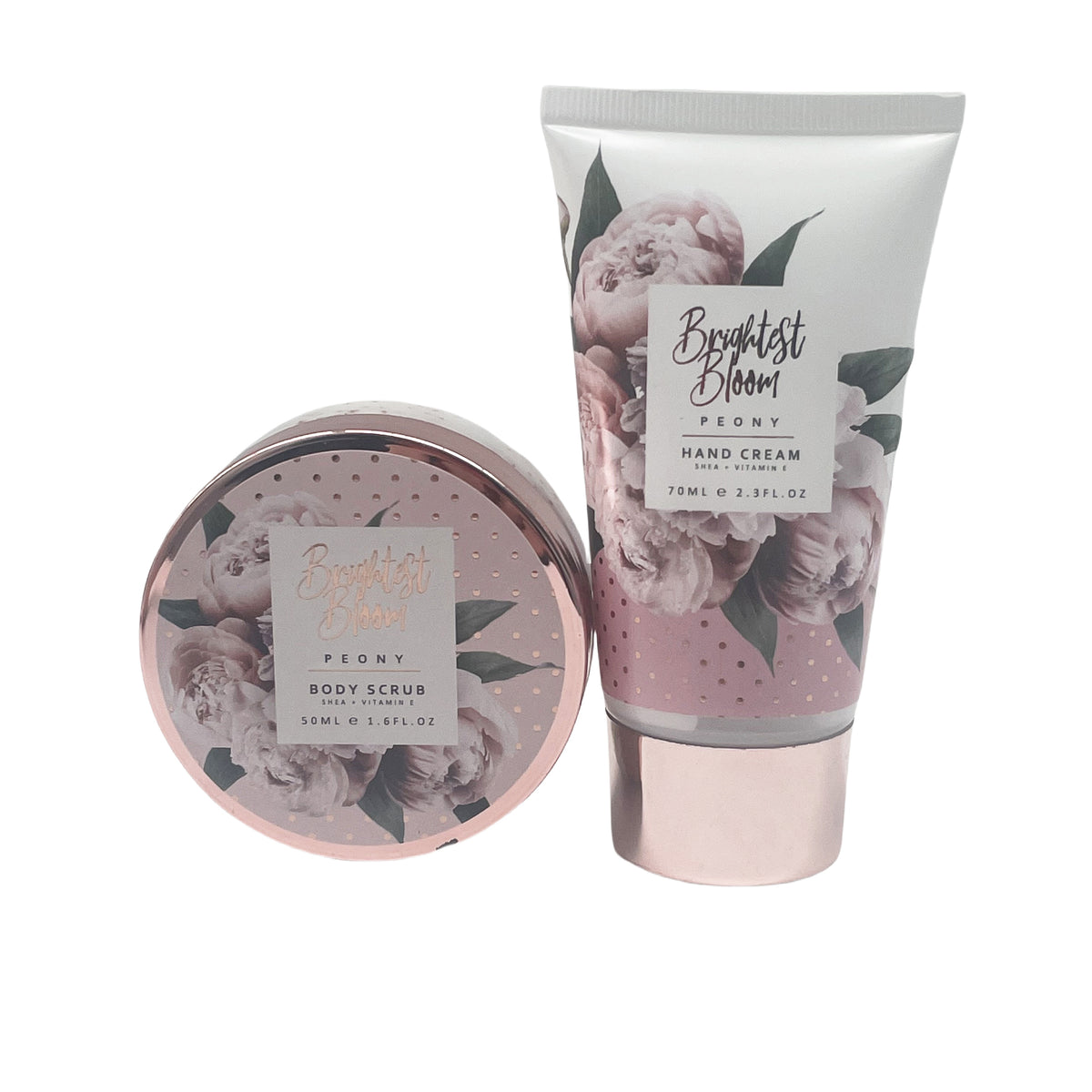 Body scrub jar with floral peony label and hand cream tube, both in gift set design.