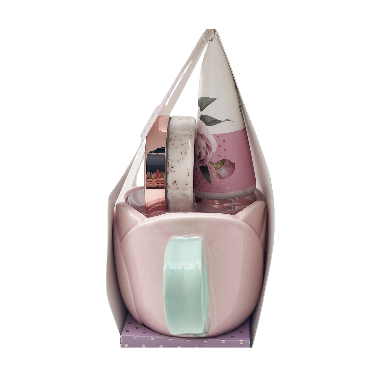 Gift bag with pink mug and mint handle, plus body care bottles in floral wrapping.