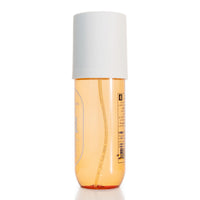 240 ml body mist bottle with amber liquid and white cap, label on the side