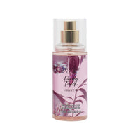 Clear pink perfume bottle with gold pump, Daring Peach Crystal label.