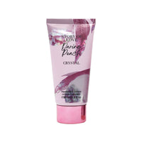 Pink Daring Peach Crystal fragrance lotion tube with floral leaf print and gold base.