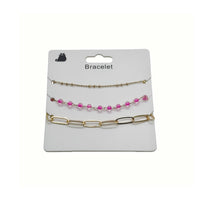 Gold-tone bracelet with pink beads and chain link segments