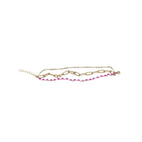 Gold-tone chain bracelet with pink bead row and curved links