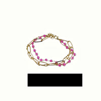 Gold-tone beaded bracelet with link segments and lobster clasp
