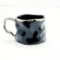 Ceramic cup with modern metallic handle design 4