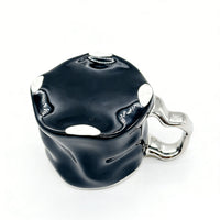 Ceramic cup with modern metallic handle design 3
