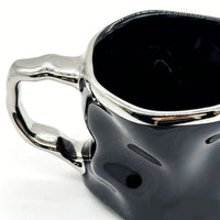 Ceramic cup with modern metallic handle design 2
