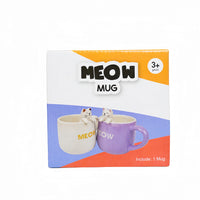 MEOW mug gift box showing purple and white cat ceramic cups.