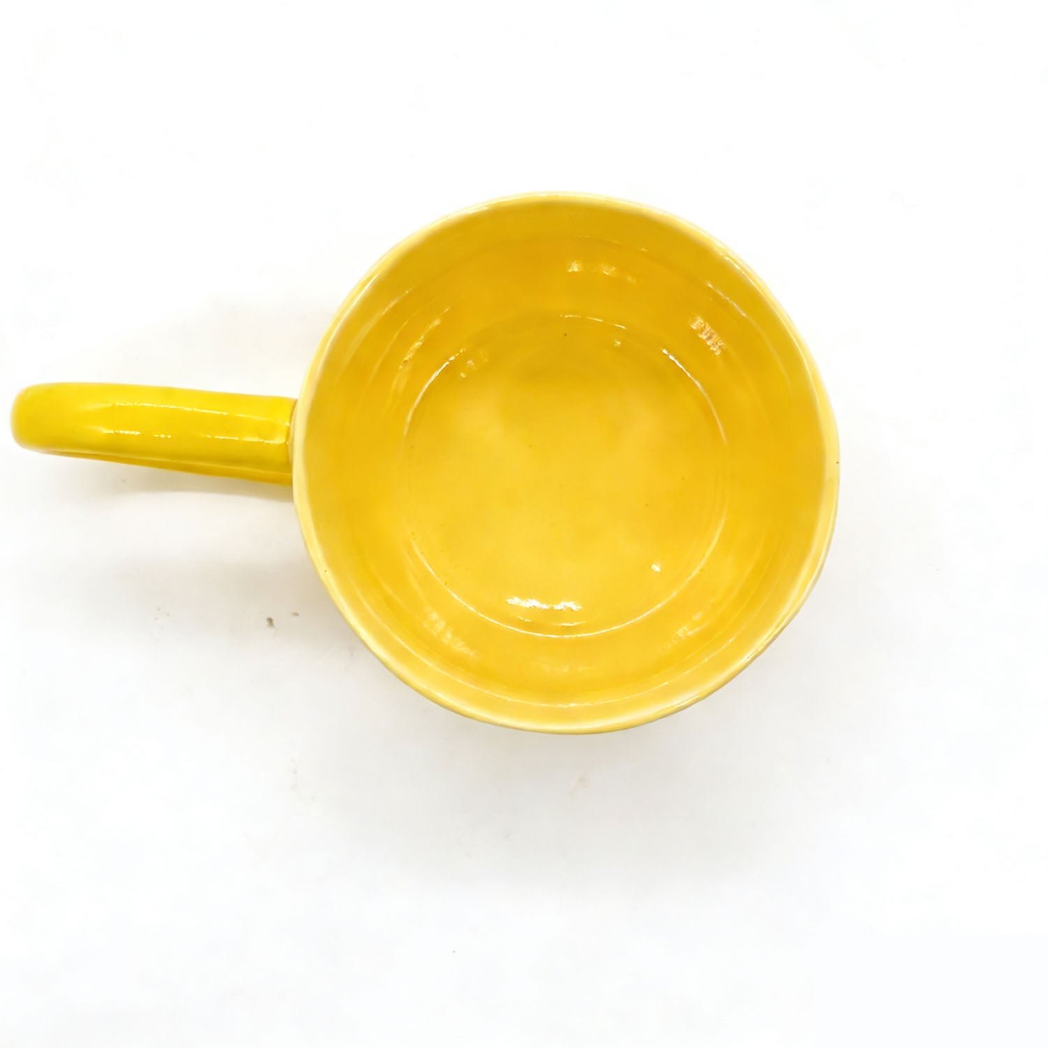 Yellow long-handle coffee cup viewed from inside top and rim