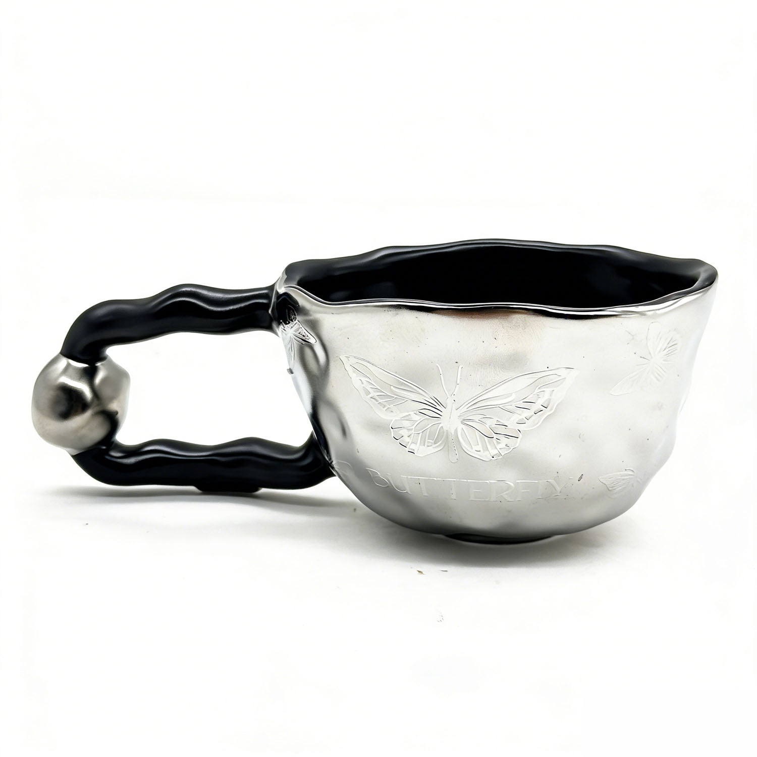 Ceramic cup with butterfly design and irregular rim 1